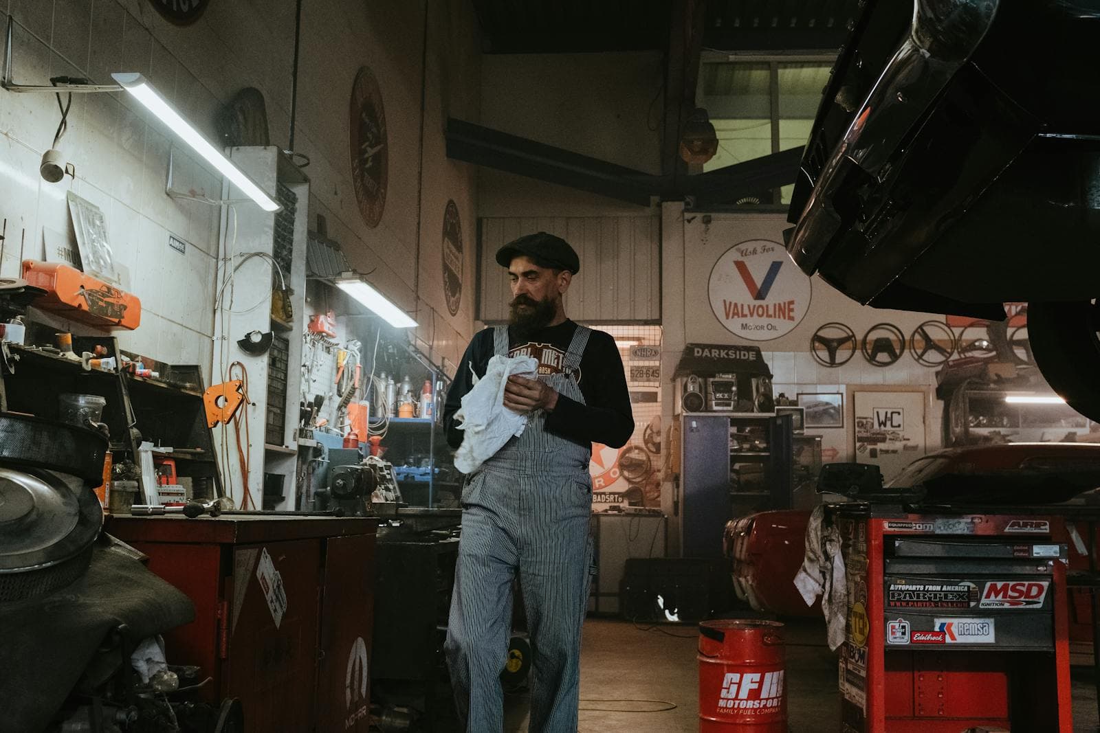 Mechanic working on a vehicle in a professional garage workshop